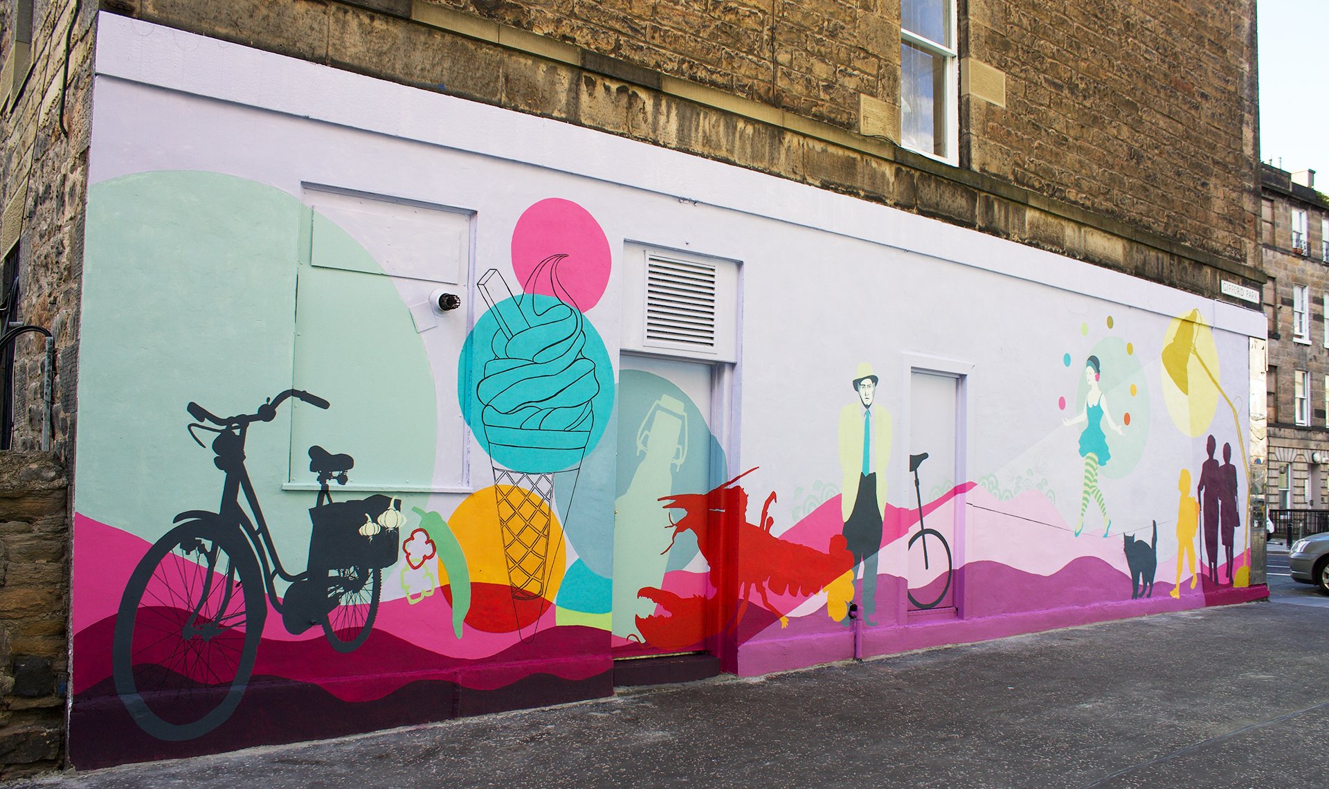 Gifford Park Mural in bright pinks and blues with artworks including ice-cream cone, a juggling tightrope walker and bicycle
